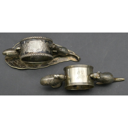 238 - An Australian Stewart Dawson & Co. silver plated napkin ring supported by kangaroo and emu, 11.5m wi... 