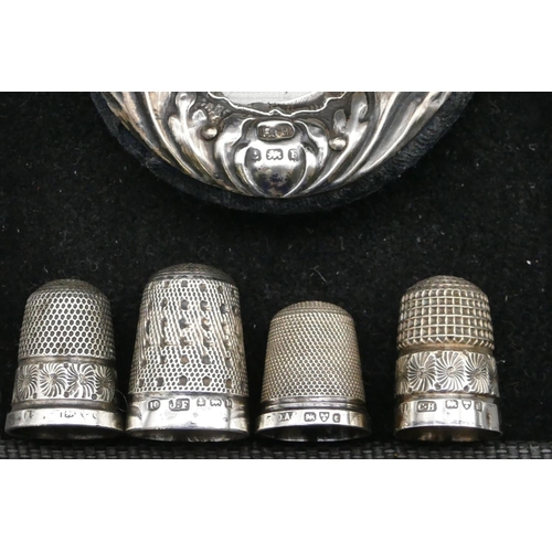 240 - 4 various silver thimbles, 2 small silver mounted photograph frames (1 frame a/f)