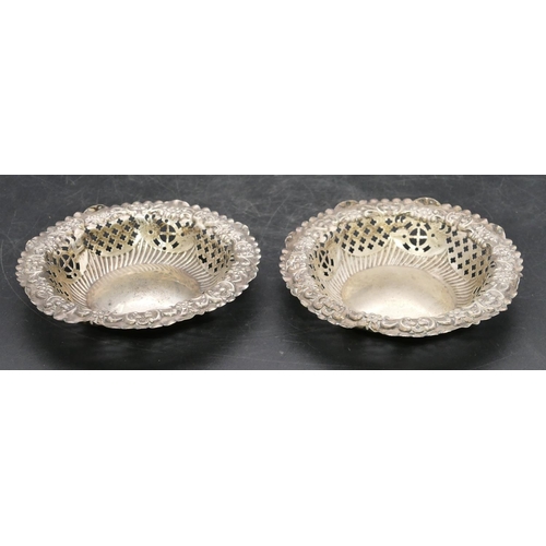 241 - A pair of Birmingham silver small round sweetmeat dishes with embossed and pierced rims, 12cm diamet... 