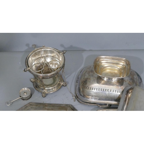 245 - A silver plated circular egg holder with sliding overhead top enclosing tray to interior, with burne... 