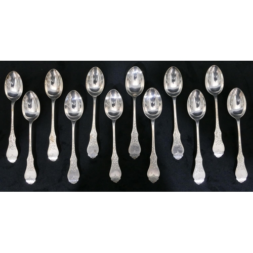 257 - A set of 12 Sheffield silver teaspoons with engraved floral and leaf handles, maker's mark K. & P., ... 