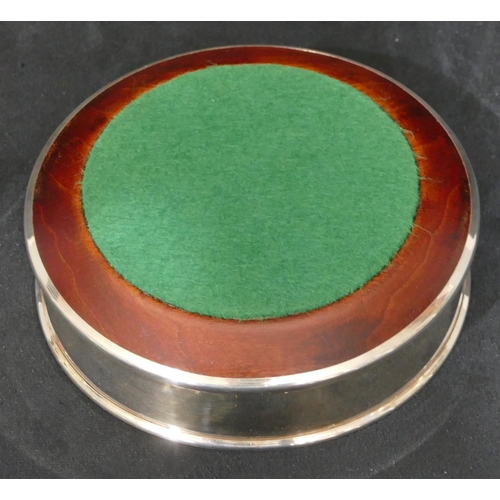 258 - A modern London silver wine coaster with wooden centre, 12.8 cm diameter.