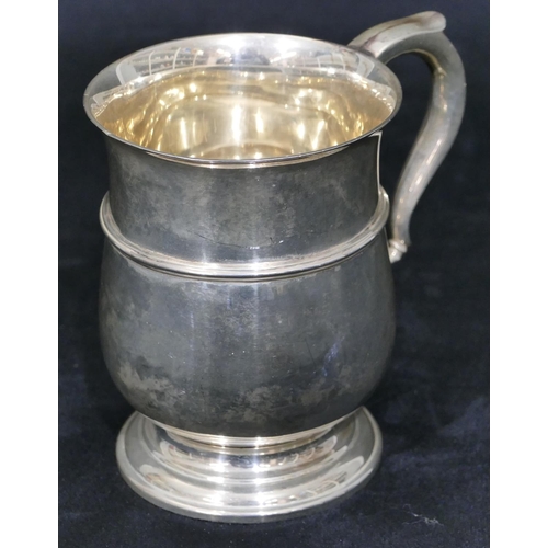 261 - A Birmingham silver small round bulbous shaped christening mug with scroll handle on splayed foot (n... 