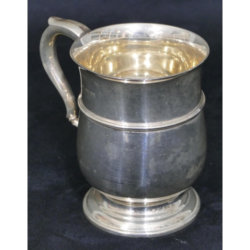 261 - A Birmingham silver small round bulbous shaped christening mug with scroll handle on splayed foot (n... 