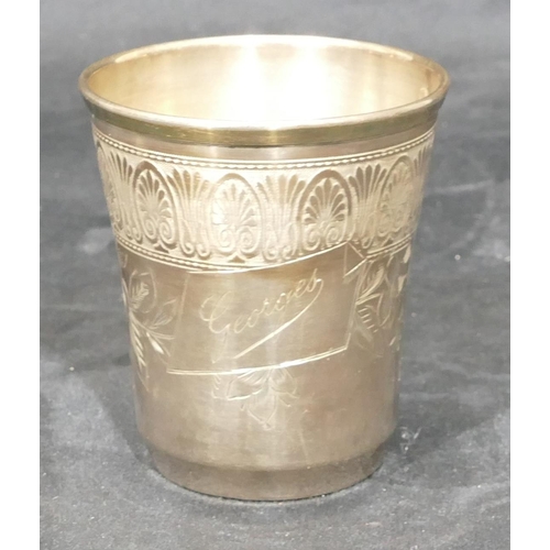 263 - A Continental silver coloured metal round trumpet shaped beaker with engraved floral and leaf decora... 