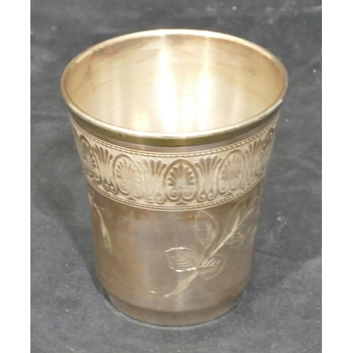 263 - A Continental silver coloured metal round trumpet shaped beaker with engraved floral and leaf decora... 