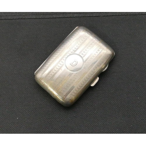 269 - A Birmingham silver small concave shaped cigarette case with part engraved decoration, hinged front,... 