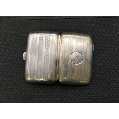 269 - A Birmingham silver small concave shaped cigarette case with part engraved decoration, hinged front,... 