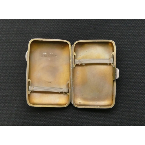 269 - A Birmingham silver small concave shaped cigarette case with part engraved decoration, hinged front,... 