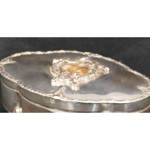 273 - A Birmingham silver oval trinket box with hinged, scallop shaped top with raised swag and ribbon dec... 