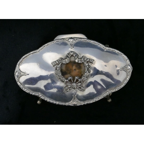 273 - A Birmingham silver oval trinket box with hinged, scallop shaped top with raised swag and ribbon dec... 