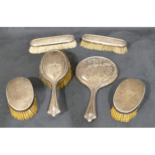 284 - A 4-piece Sheffield silver mounted dressing table set, hand mirror and 3 brushes, a pair of London s... 