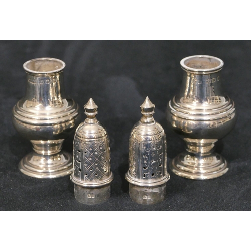 289 - A pair of Birmingham silver small round bulbous shaped pepperpots on sweeping bases, 9cm high 1.8oz