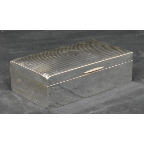 290 - A Birmingham silver rectangular shaped cigarette box with engine turned hinged lid, 16.2cm wide