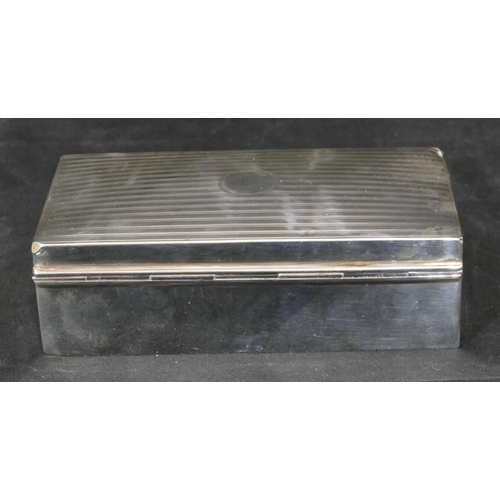 290 - A Birmingham silver rectangular shaped cigarette box with engine turned hinged lid, 16.2cm wide