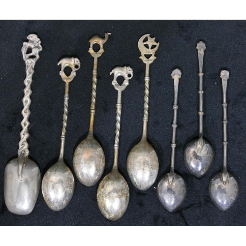 293 - A set of 4 Eastern silver coloured metal coffee spoons with elephant and camel finials, a set of 3 E... 