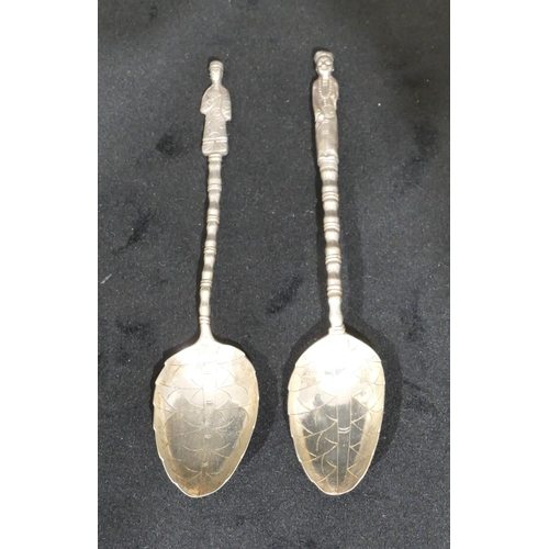 297 - 2 Chinese silver coloured metal teaspoons, with figure motifs, bamboo shaped stems, 0.7oz (2)