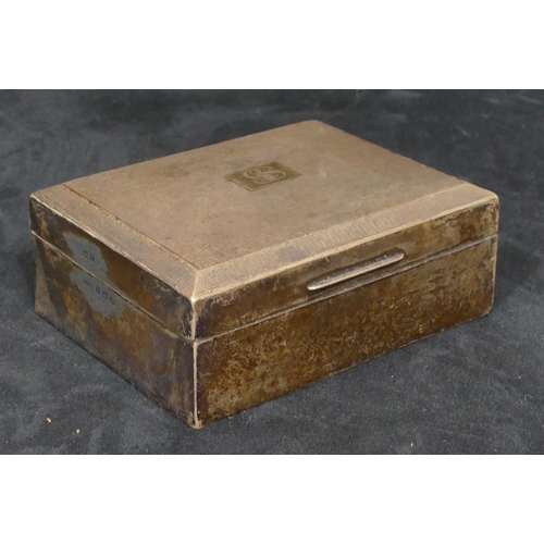 310 - A Birmingham silver rectangular shaped cigarette box with engine turned hinged lid, 11.5cm wide