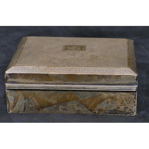 310 - A Birmingham silver rectangular shaped cigarette box with engine turned hinged lid, 11.5cm wide