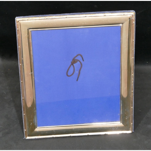 321 - A modern silver plated rectangular freestanding photograph frame, 32cm x 27cm