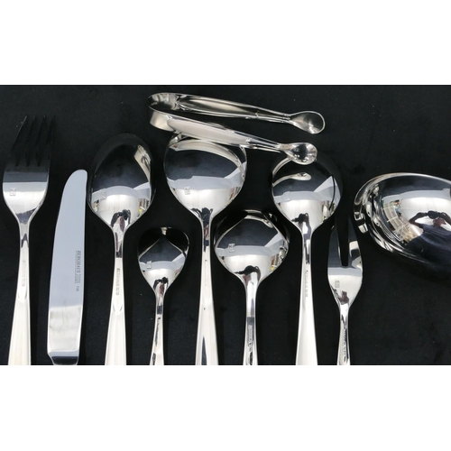 323 - A Berghaus 12-place setting flatware service, soup ladle, 8 various serving spoons and forks, pair o... 