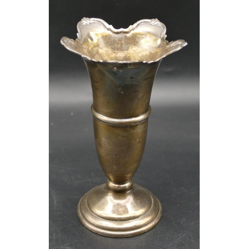 331 - A Birmingham silver round trumpet shaped spill vase with crinkled rim on round sweeping weighted bas... 