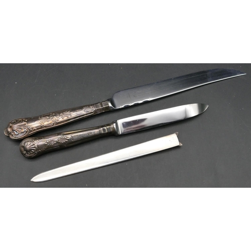 332 - A modern London silver paper knife with fox's head motif, a silver handled bread knife and a silver ... 