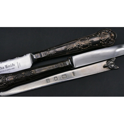 332 - A modern London silver paper knife with fox's head motif, a silver handled bread knife and a silver ... 