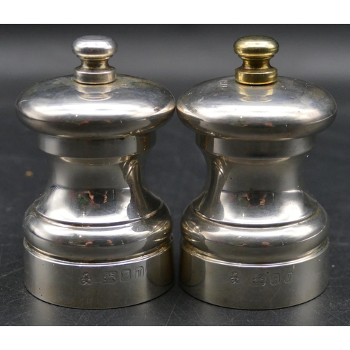 339 - A pair of modern London silver squat pepper and salt grinders, 7cm high.