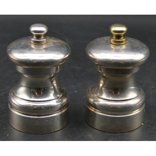 339 - A pair of modern London silver squat pepper and salt grinders, 7cm high.