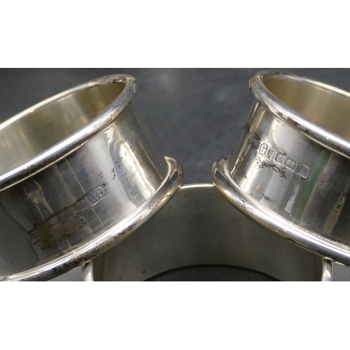 341 - A set of 6 George V round silver napkin rings, Birmingham 1923, makers mark GU, 2.8oz.