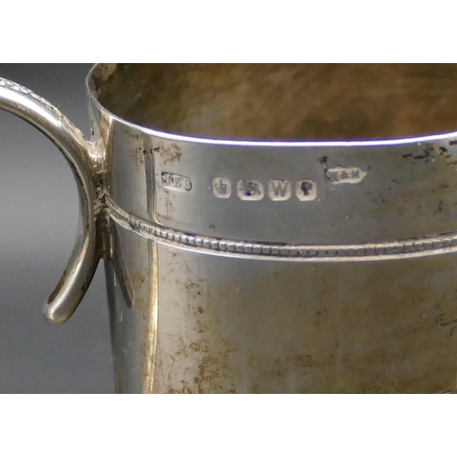 343 - A Victorian Sheffield silver christening mug with engraved decoration, scroll handle, 8cm high, 3.2o... 