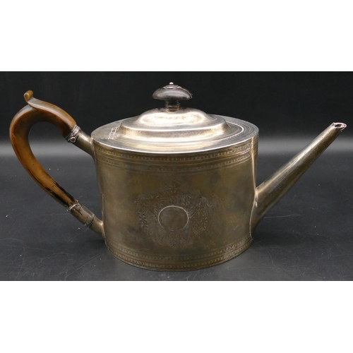 344 - An 18th Century George III oval silver teapot with engraved decoration, wooden handle and finial, Lo... 