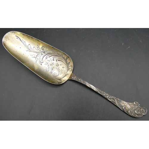 354 - A Continental 800 silver coloured metal serving spoon with raised and engraved floral, leaf and scro... 