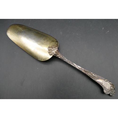 354 - A Continental 800 silver coloured metal serving spoon with raised and engraved floral, leaf and scro... 