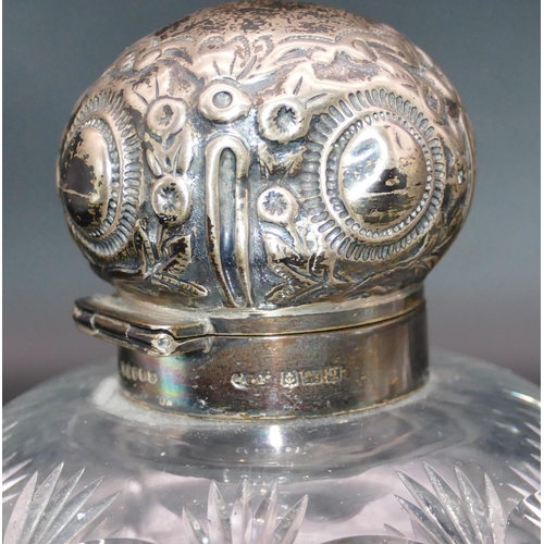 358 - A pair of George V heavy cut glass round bulbous shaped scent bottles with silver necks, hinged lids... 