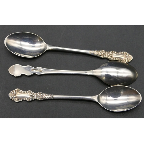 374 - A set of 6 modern Birmingham silver coffee spoons, scroll handles in fitted blue leather case, 1.4oz