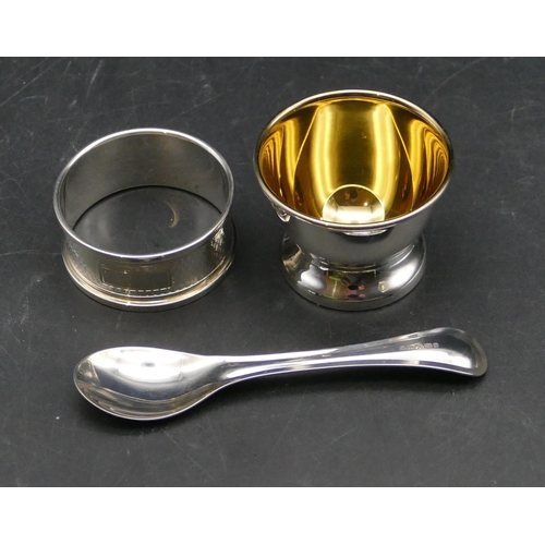 375 - A modern London 925 silver egg cup and matching spoon, a Birmingham silver napkin ring, 1.5oz