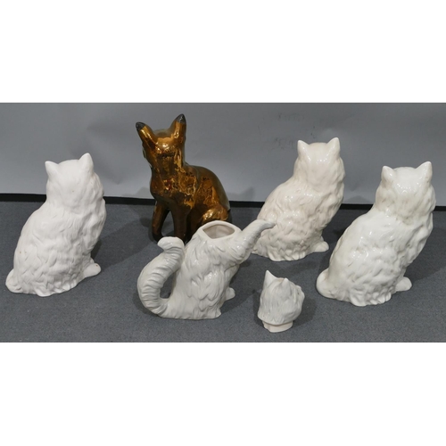 39 - 3 white Beswick figures of seated cats 1867, 21cm high, a Beswick figure of a seated Siamese cat on ... 