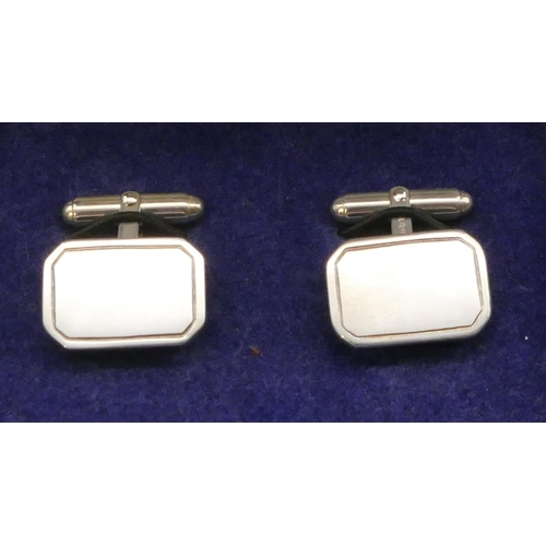 395 - A pair of modern silver plain rectangular shaped gentleman's cufflinks, boxed.