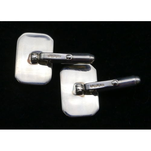 395 - A pair of modern silver plain rectangular shaped gentleman's cufflinks, boxed.