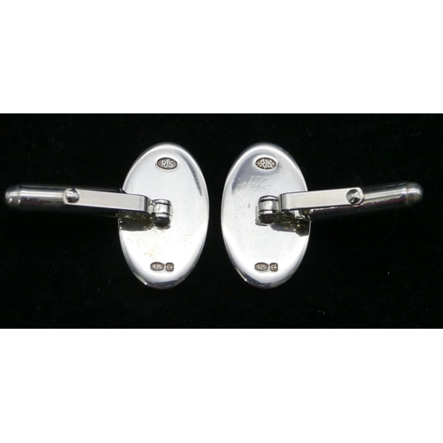 396 - A pair of modern silver oval plain gentleman's cufflinks, boxed.