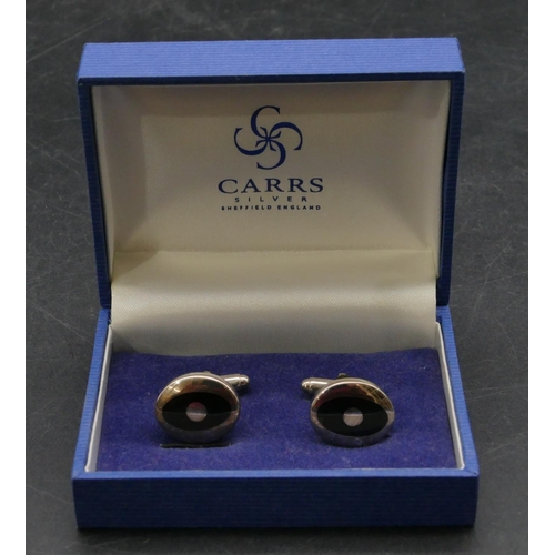 397 - A modern silver oval gentleman's cufflinks with black inset, boxed.