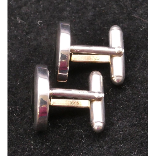 397 - A modern silver oval gentleman's cufflinks with black inset, boxed.