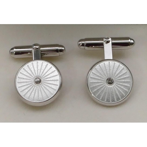 398 - A pair of modern silver circular gentleman's cufflinks, boxed.