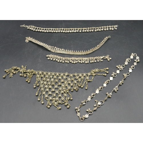 403 - An Eastern silver coloured metal chain with drop ball motifs and 4 various other similar chains, 227... 