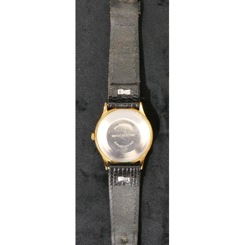 407 - A Timex Water Resistant black faced circular gentleman's wristwatch with seconds hand and calendar, ... 