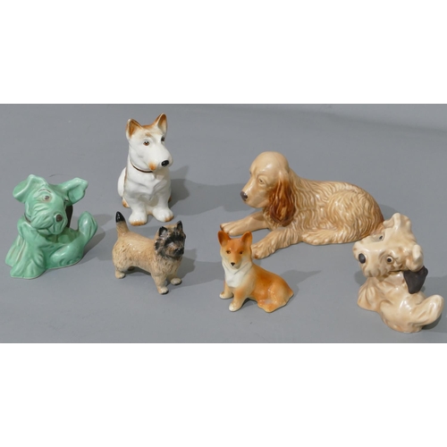 42 - A Sylvac figure of a lying dog 114, a Beswick figure of a terrier and 2 Sylvac figures of dogs with ... 