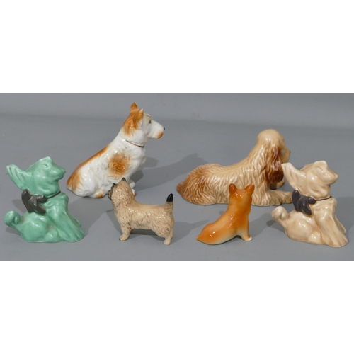 42 - A Sylvac figure of a lying dog 114, a Beswick figure of a terrier and 2 Sylvac figures of dogs with ... 