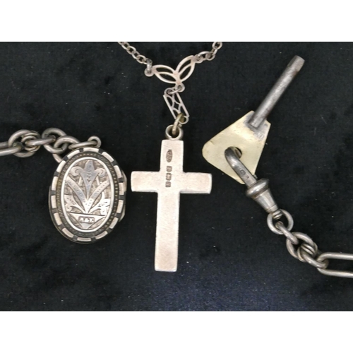 420 - A silver watch chain with T-bar and mounted with oval locket, 35cm long, a silver cross pendant with... 